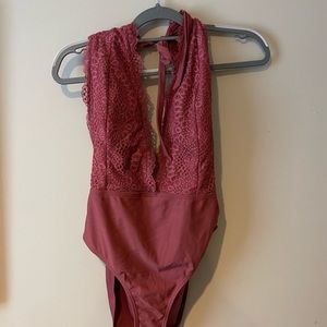 Women's one piece swim suit with deep v front and cut out back with lace detail